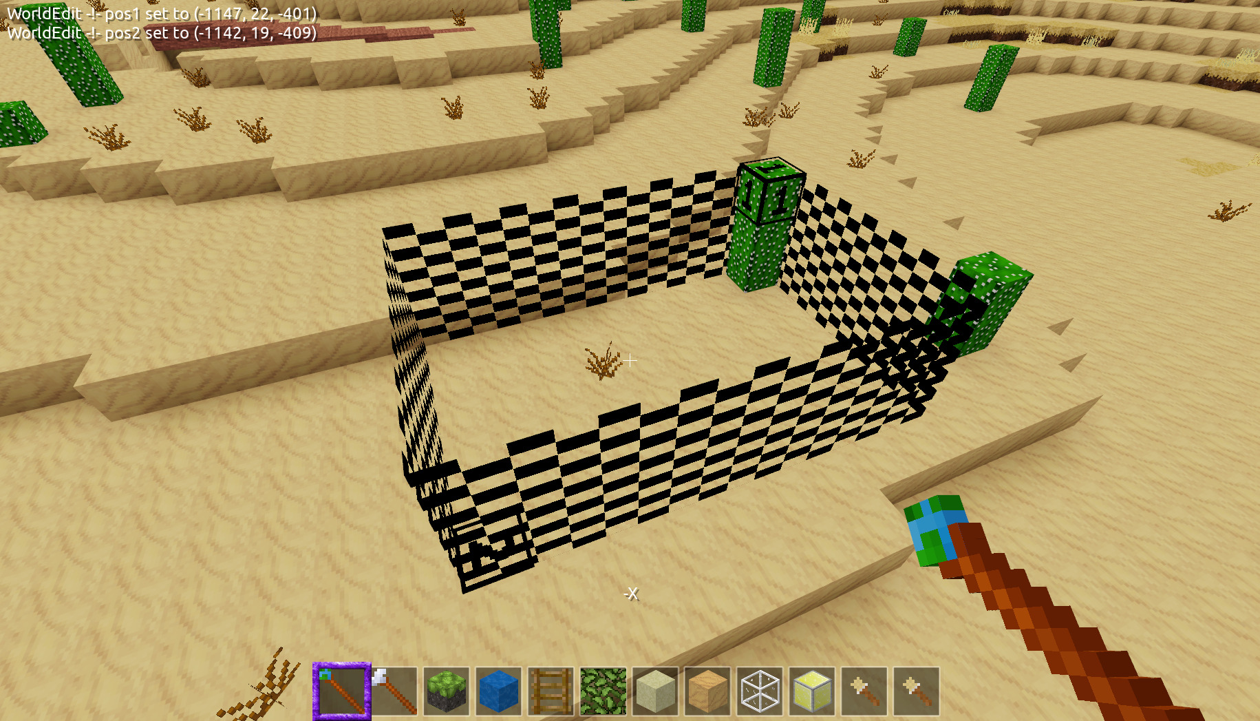 A screenshot showing WorldEdit points 1 and 2 in a desert with a cactus